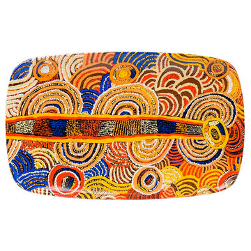 Colorful patterned rectangle platter with circular designs on a white background.