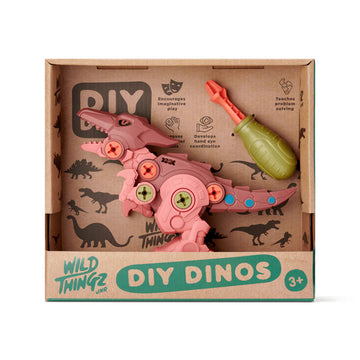 Pink dinosaur toy with accessories in a 'Wild Thingz' DIY Dinos packaging on a white background.
