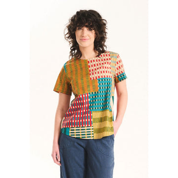 A women's short sleeve top with an abstract stripe pattern in yellow, blue and red.