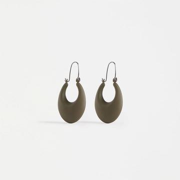 A pair of hoop shaped earrings with a wide dark green base.