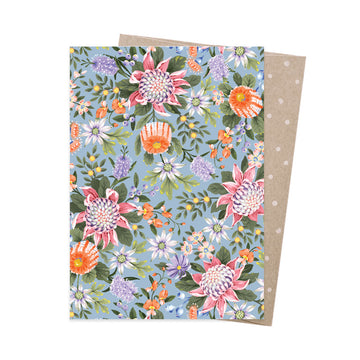 Floral patterned card with a polka dot envelope on a white background.