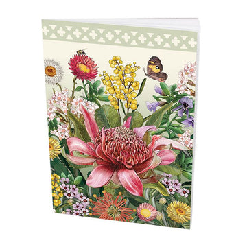 Floral design with a prominent pink flower on a small notebook.