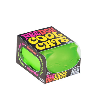 A green cat shaped stress ball inside a box with cut outs and the text 'Nee Doh Cool Cats' written on the top and front.