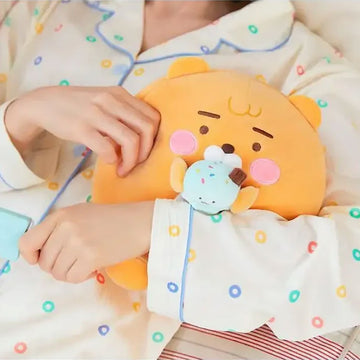 Yellow plush toy holding a small ice cream cone plush toy on a white background.