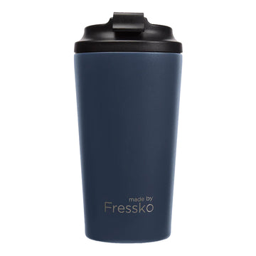 A tall travel mug in denim blue&nbsp;with a black lid and the text 'made by Fressko' on the bottom.