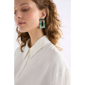 Pair of earrings with colorful rectangular stones on a white background