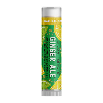A tube of lip balm with the text 'Ginger Ale' and images of lime and lemon slices on a green label.