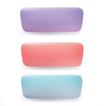 Three closed hard shell glasses cases in purple, coral pink and blue.