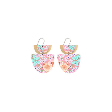 A pair of drop earrings with a double layered semi circle at the top and a larger semi circle at the bottom printed with florals.