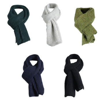 Five different coloured alpaca wool scarves looped like they are being worn around a neck.