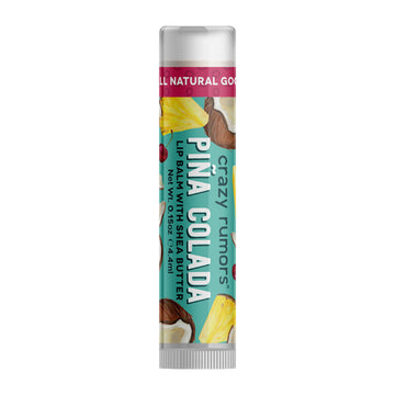 A tube of lip balm with the text 'Pina Colada' on the front with images of pineapples and coconuts on a green label.