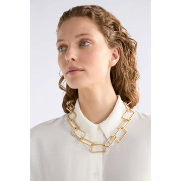 A silver chunky chain necklace on a white background.