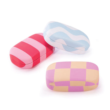 Three hard shell cases each with a different pattern and colour printed on them.