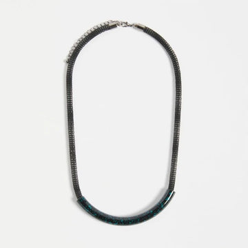 Necklace with black and blue features on a white background.