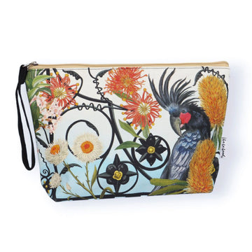 Clutch bag with a black cockatoo and floral design on a white background.