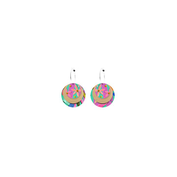 A pair of hoop earrings with three circle layers attached. The top and bottom layer are printed with a colourful floral pattern and the middle layer is gold.