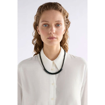 Necklace with black and blue features on a white background.