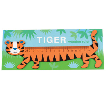 An orange tiger ruler with black stripes walking in a garden.