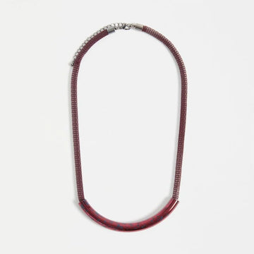 Necklace with red details on a white background.