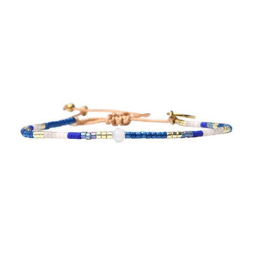 A beaded bracelet in blue and gold.