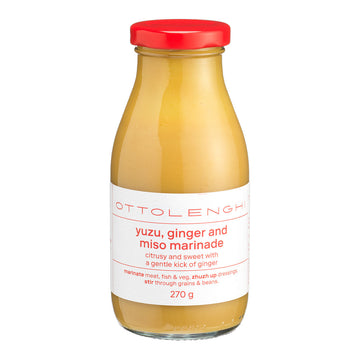Bottle of Ottolenghi yuzu, ginger and miso marinade with a red cap on a white background.