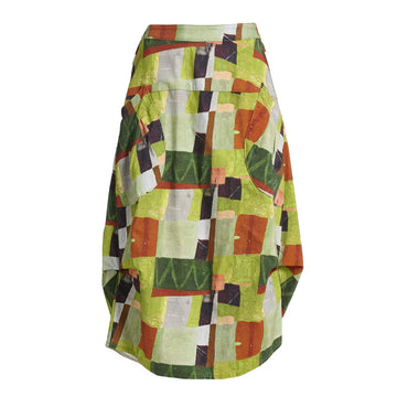A skirt printed with a green and brown pattern with side pockets and side tucks.