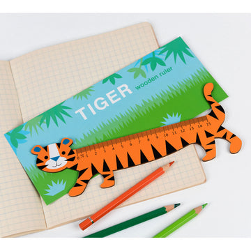 An orange tiger ruler with black stripes walking in a garden.