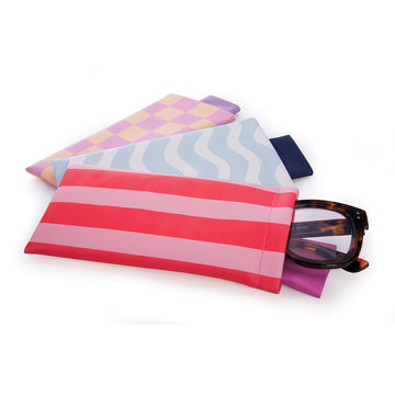 Three glasses cases each with a different pattern and colour on them.