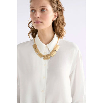 Silver necklace with textured design on a white background.