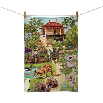Tea towel with a colorful illustration of Australian animals and a house on a garden scene.