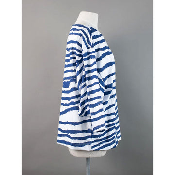 Front view of a blue and white striped long sleeve top on a mannequin against a gray background.