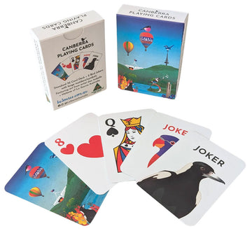 A pack of playing cards pictured with hot air balloons on the front. Five cards are pictured outside the box.