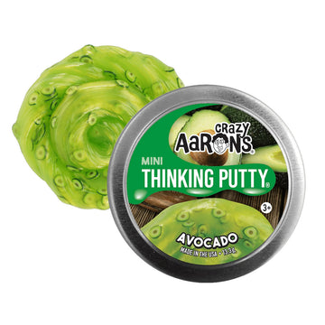 A silver tin with the heading 'Crazy Aarons Mini Thinking Putty Avocado' with green putty behind.