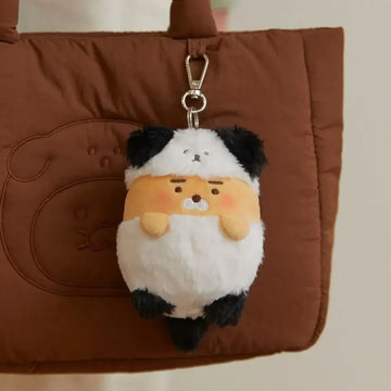 Plush keychain shaped like a puppy on a white background.