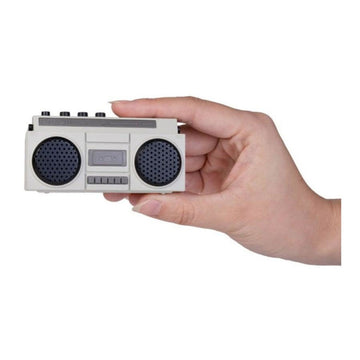 A hand is holding the world's smallest boom box.