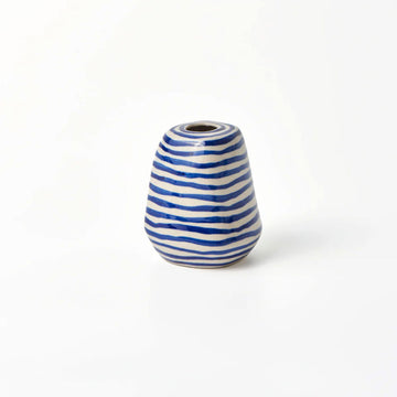 A small vase in cream with blue horizontal stripes.