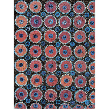 A painting by Drusilla Nangala Spencer featuring circles in brown and orange on a dark background.