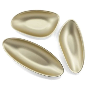 Three gold-colored teardrop-shaped objects on a white background.