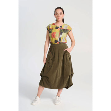 An olive skirt made from fine cord with side pockets and side tucks.