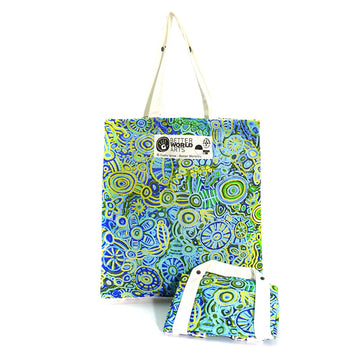 A tote bag printed with artwork by Cedric Varcoe is standing up at the back with another folded up bag with the same artwork in front.