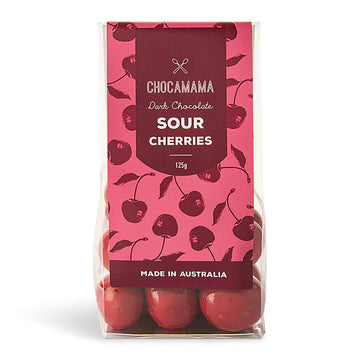 A clear bag filled with red chocolate covered cherries with a red product label on the bag.