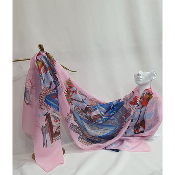 Colorful scarf with abstract design draped over a mannequin on a white background.