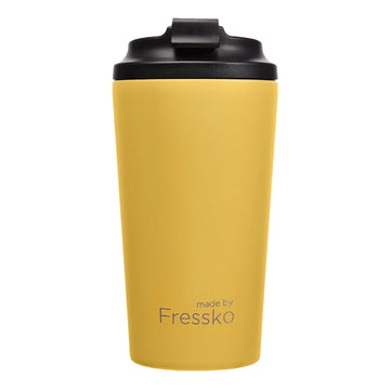 A tall travel mug in yellow with a black lid and the text 'made by Fressko' on the bottom.