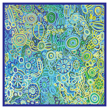 A square table cloth printed with artwork by Cedric Varcoe in blue and yellow.