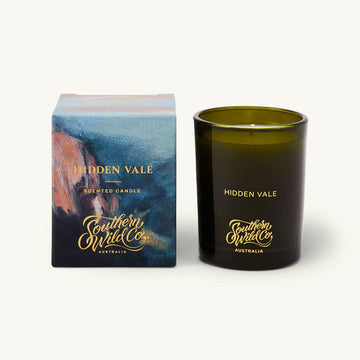 Hidden Vale candle and packaging with Southern Wild Co branding on a white background.