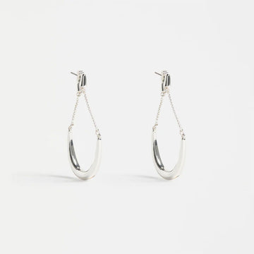 Pair of silver hoop earrings on a white background.