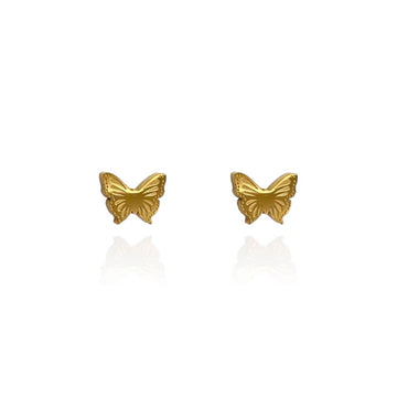 A pair of butterfly shaped gold stud earrings.