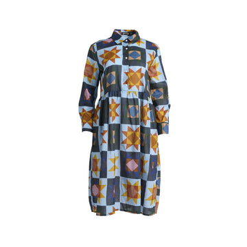 A long sleeve shirt dress with a gathered waist and printed with a star pattern in blue and yellow.