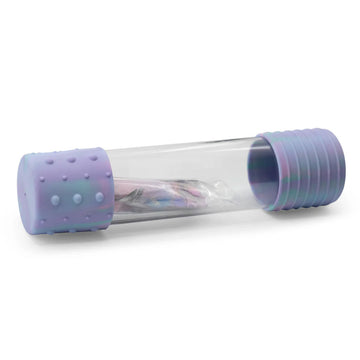 A clear bottle with purple silicone sides and a packet of glitter inside.