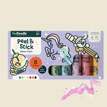 Packaging of Hey Doodle Peel & Stick Glitter Paint set with unicorn designs on a beige background.